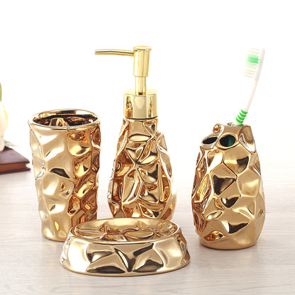 Kit de banheiro Aurum em cerâmica dourada com quatro peças
